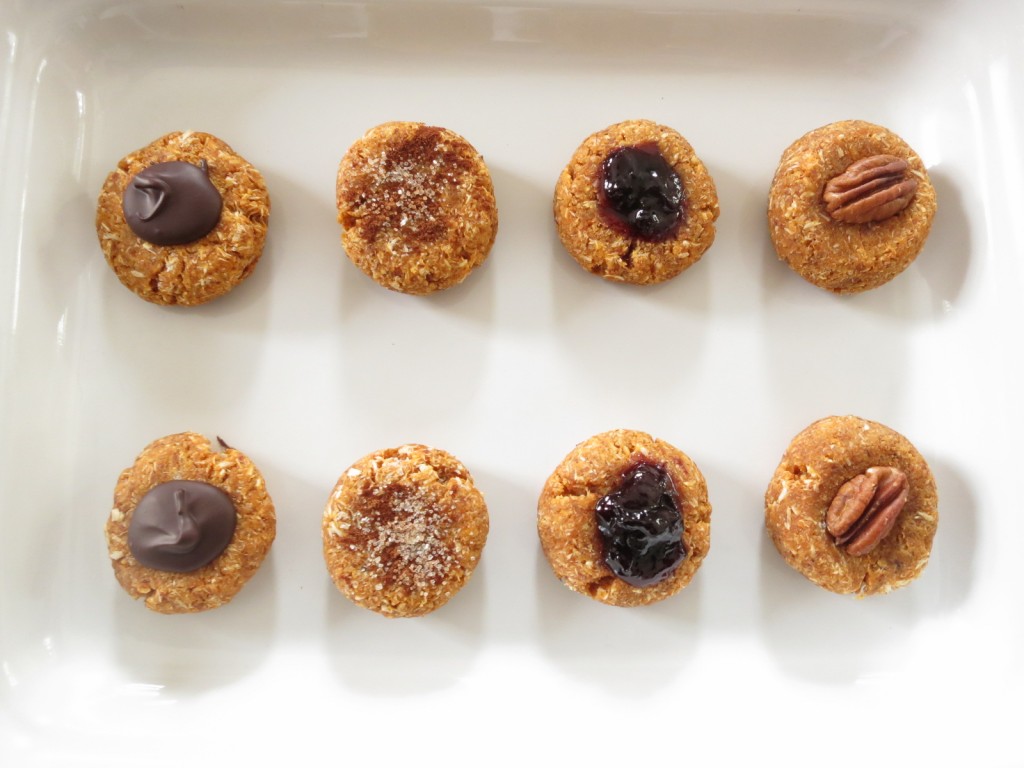 Panellets with chocolate,  cinnamon and sugar, cherry jam, and pecan